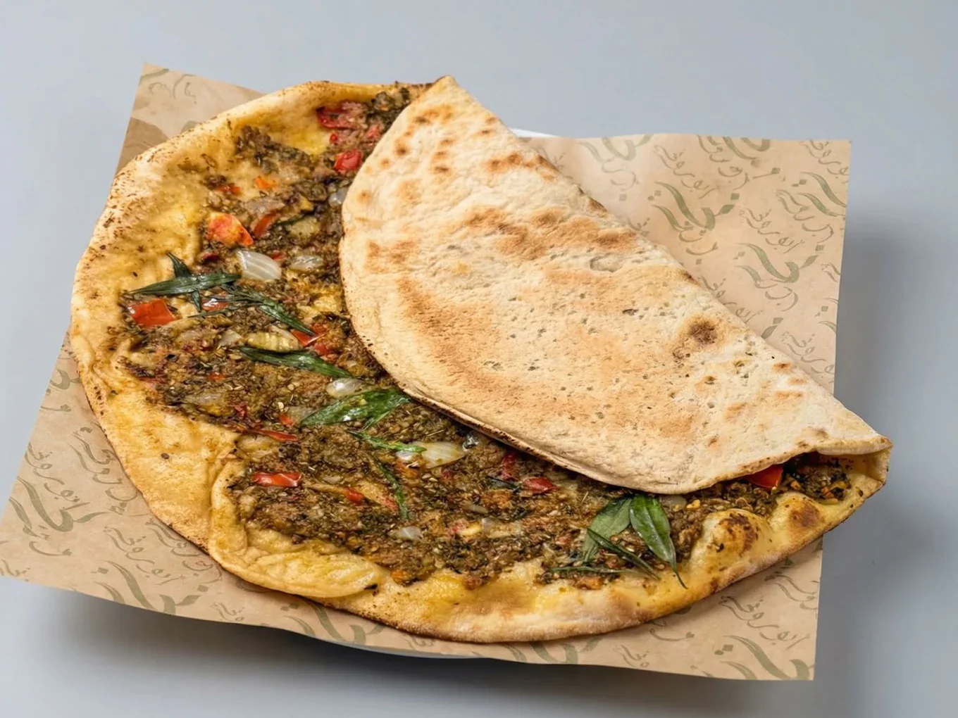 Flatbread presentation at Abou Rony restaurant in Dubai.