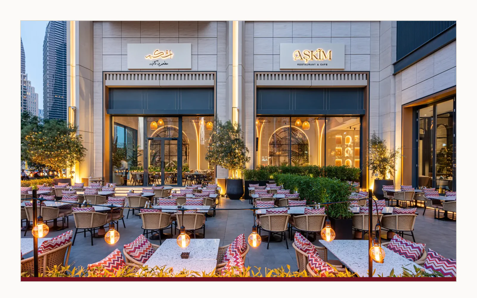 Current exterior signage showing the AŞKIM Arabic mark and restaurant name in Downtown Dubai.