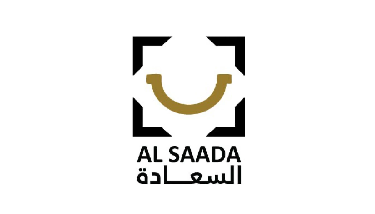 Original al Saada logo with a gold smile, black frame, and English and Arabic lettering